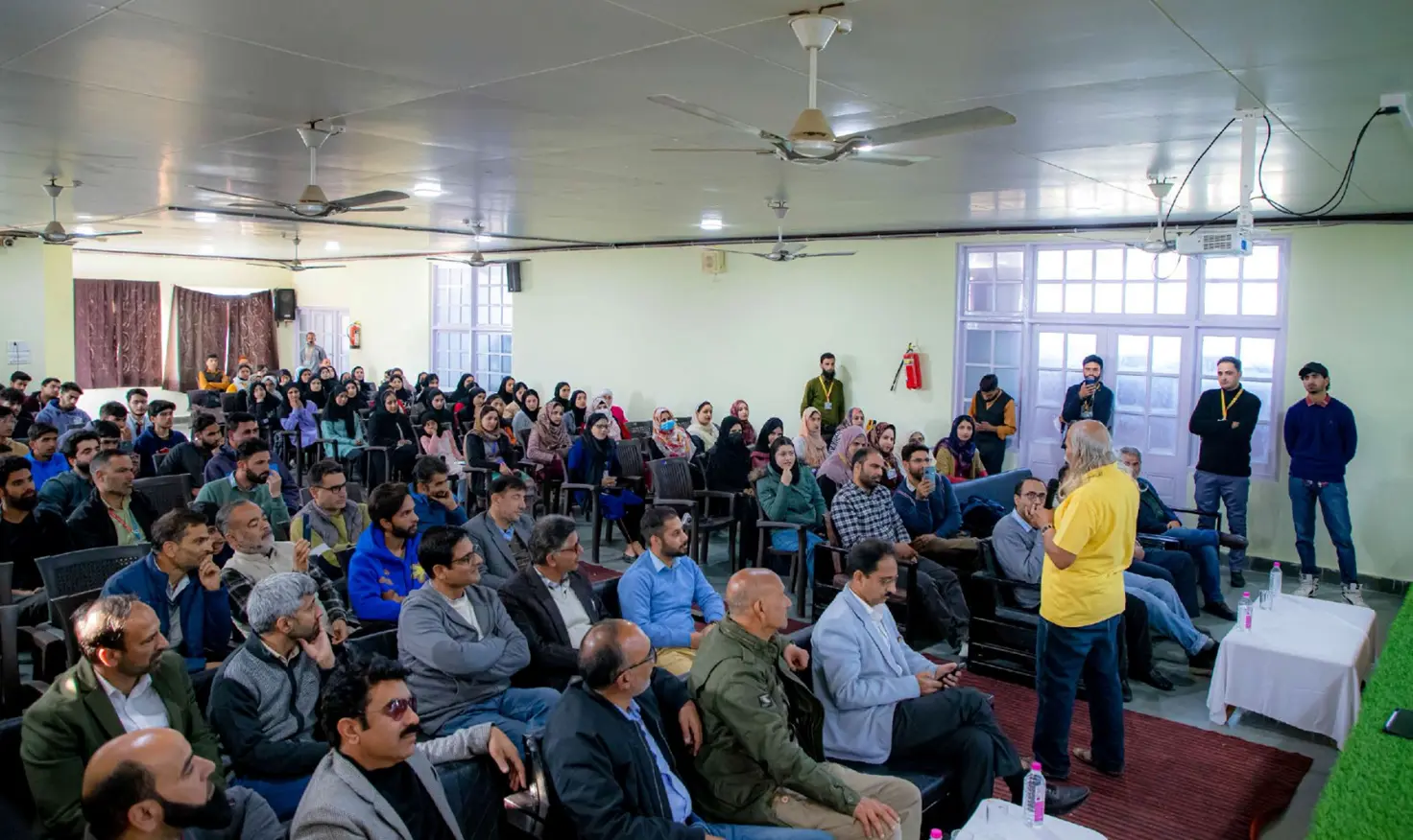 Prof. H. C. Verma interacting with students in the school auditorium, October 2023